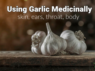 garlic for home remedy use on wooden plank