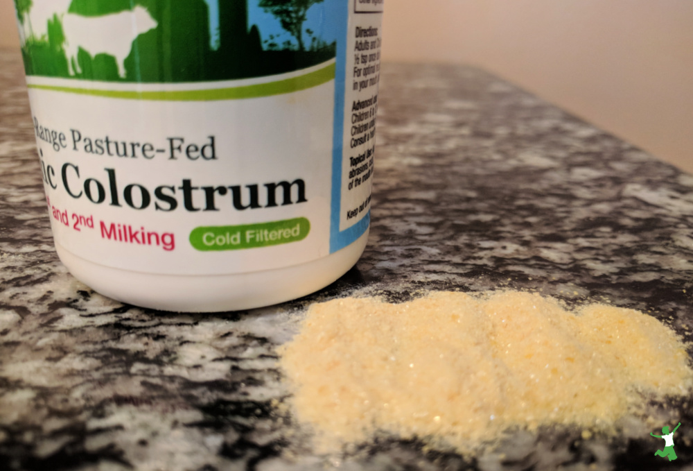 pastured colostrum powder and bottle on table
