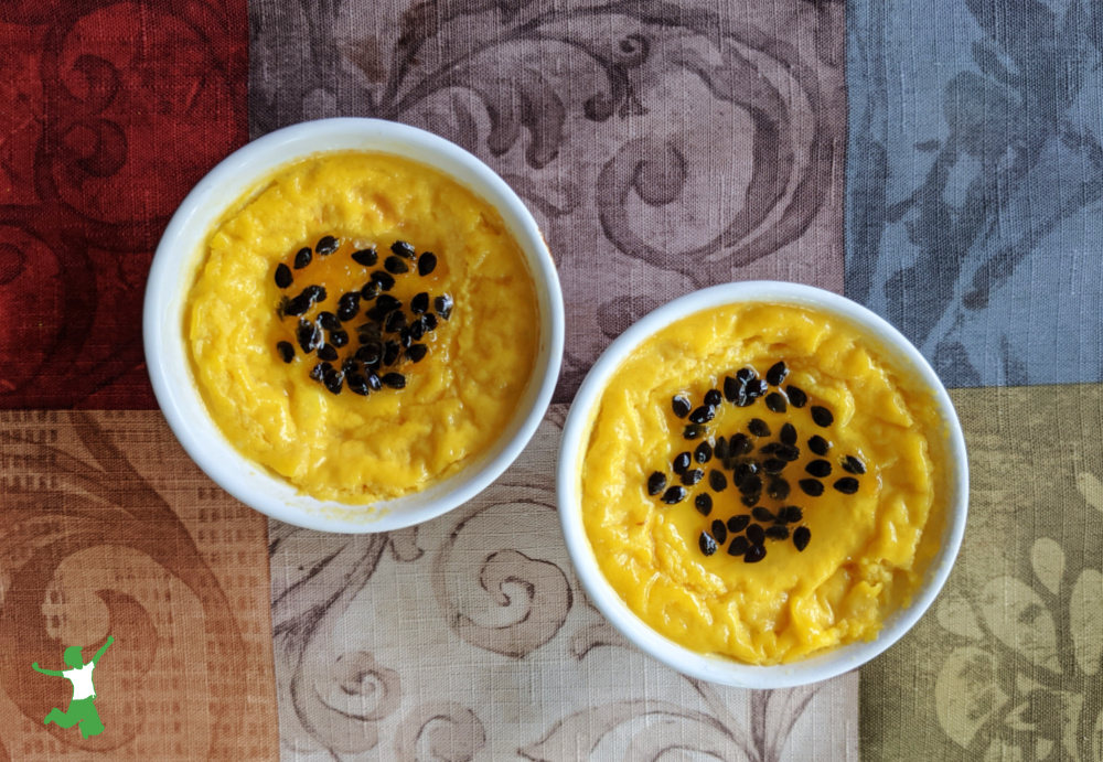 ramekins of passion fruit custard on tablecloth