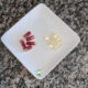 krill oil capsules and cod liver oil on a white plate