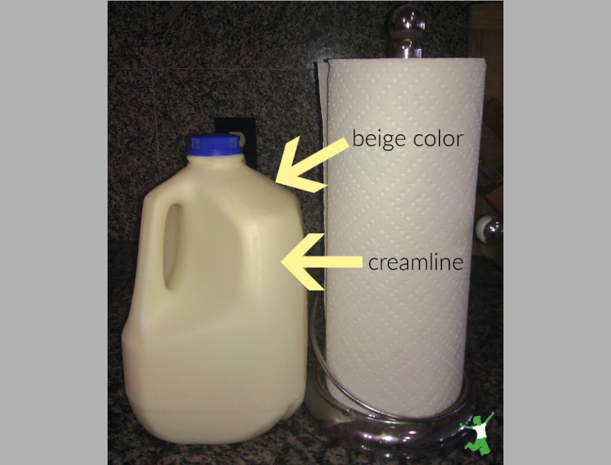 beige color of pastured milk in a jug compared to white paper towels