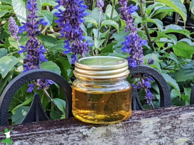 neutral taste coconut ghee in glass jar flower background