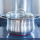 pot of cumulative time bone broth simmering on stovetop