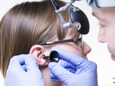 young girl being examined for ear tubes