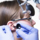 young girl being examined for ear tubes