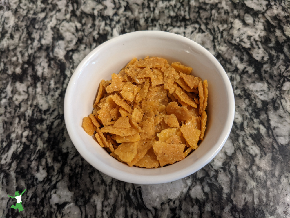 healthy homemade corn flakes in a white bowl