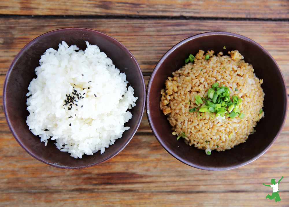 arsenic-free brown and white rice in bowls on wooden table