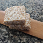 healthy marshmallow krispies bars on wooden spatula