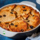 bread and butter pudding in white baking dish