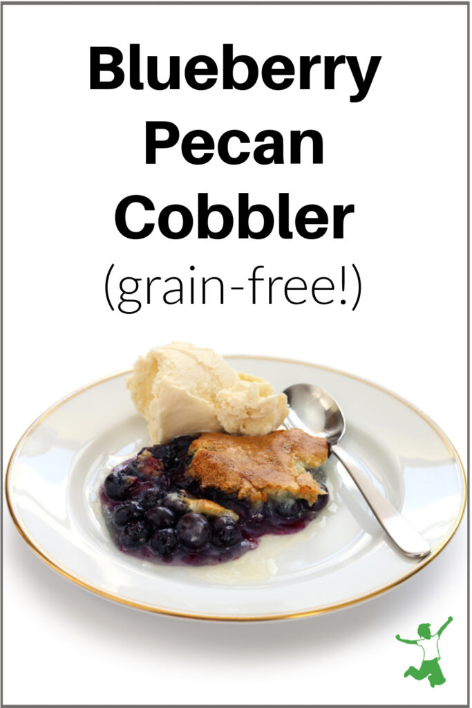 healthy, grain-free blueberry pecan cobbler on a plate with ice cream