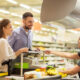 couple using whole foods biometric checkout