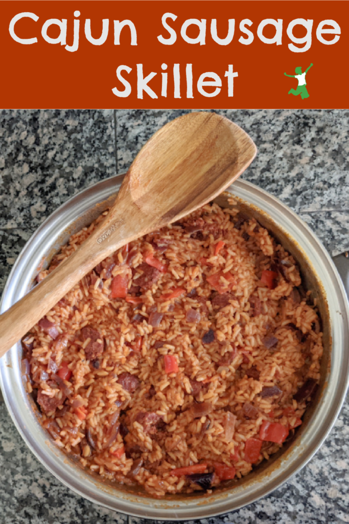 healthy cajun sausage skillet on granite counter with wooden spoon