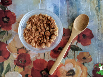 healthy cinnamon crunch in bowl with bamboo spoon