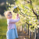 child enjoying healing bee frequency from golden hum of buzzing hive