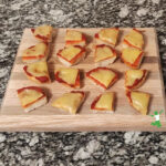 healthy, homemade pizza bites arranged on wood