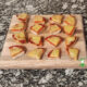 healthy, homemade pizza bites arranged on wood