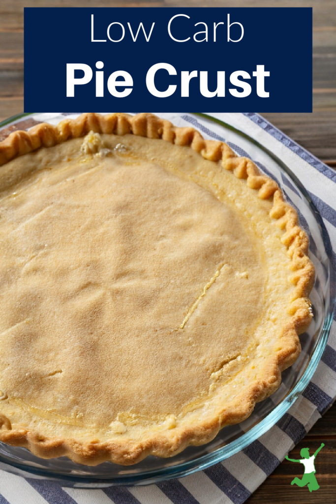 healthy keto pie crust in glass plate on striped tablecloth