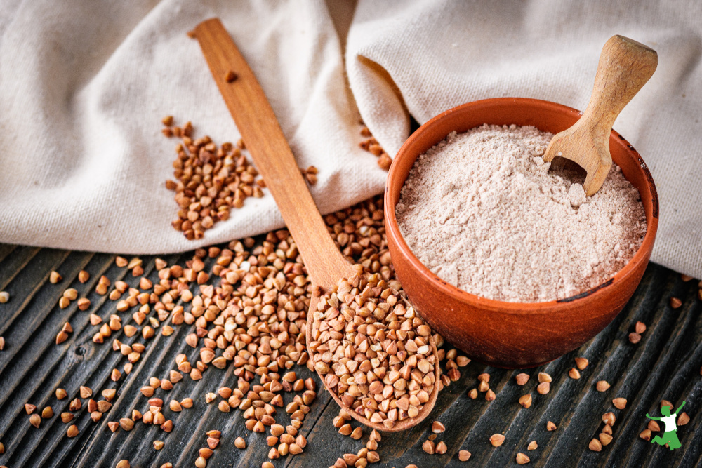 buckwheat groats and flour in clay bowl with white tablecloth