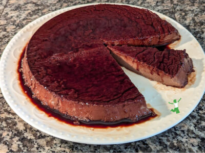 traditional flan sweetened with fruit on white plate