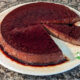 traditional flan sweetened with fruit on white plate