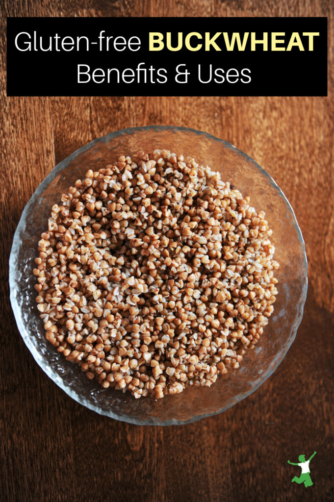 glass bowl of buckwheat groats with wooden background