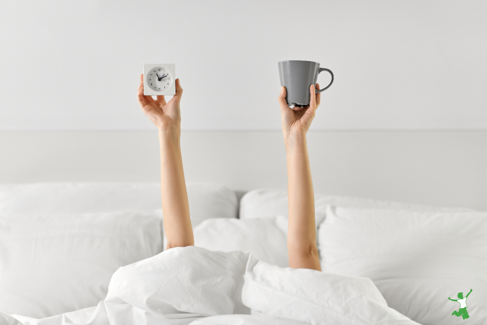 woman drinking coffee in the morning before getting out of bed