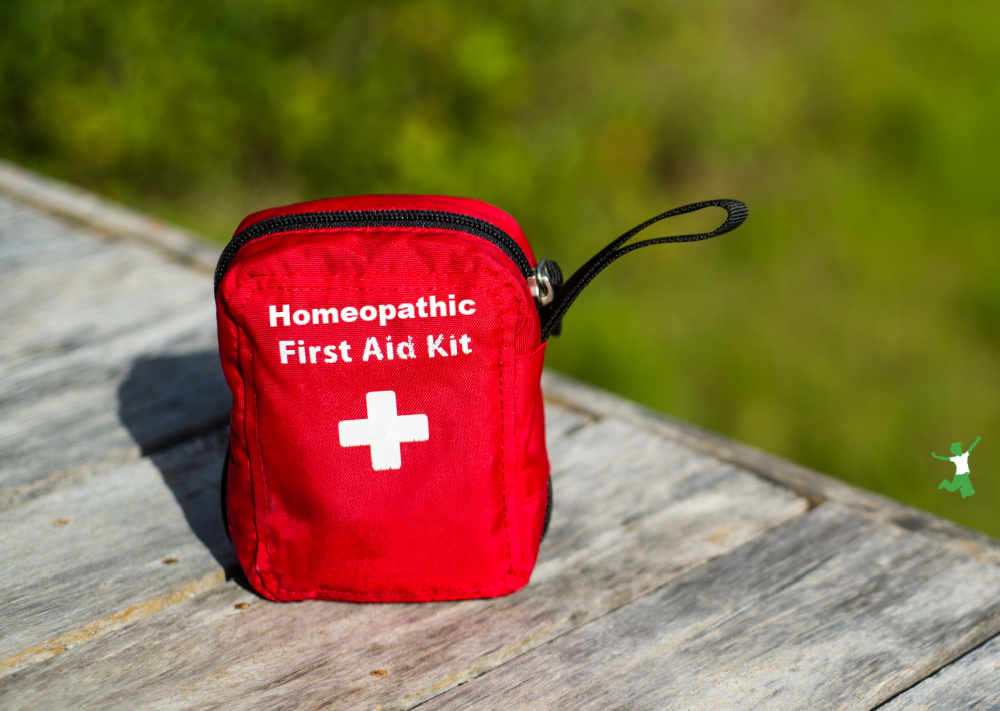 homeopathic holistic first aid kit on wooden dock