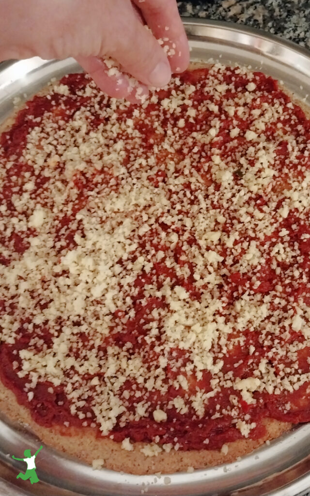 healthy shredded cheese sprinkled on a homemade pizza