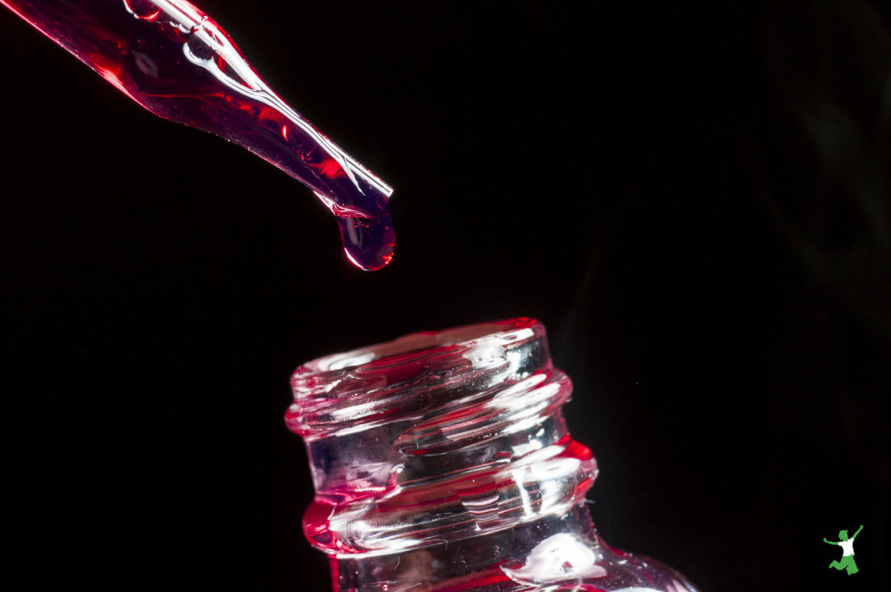 drops of vegetable glycerin from eyedropper into bottle