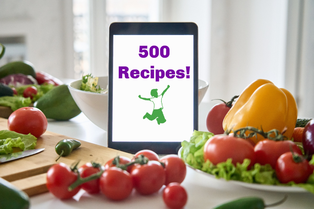 smartphone in the kitchen with 500 recipes and healthy home economist logo