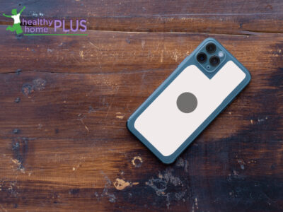 mobile phone EMF sticker wooden background