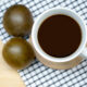 cup of coffee sweetened with monk fruit on tablecloth