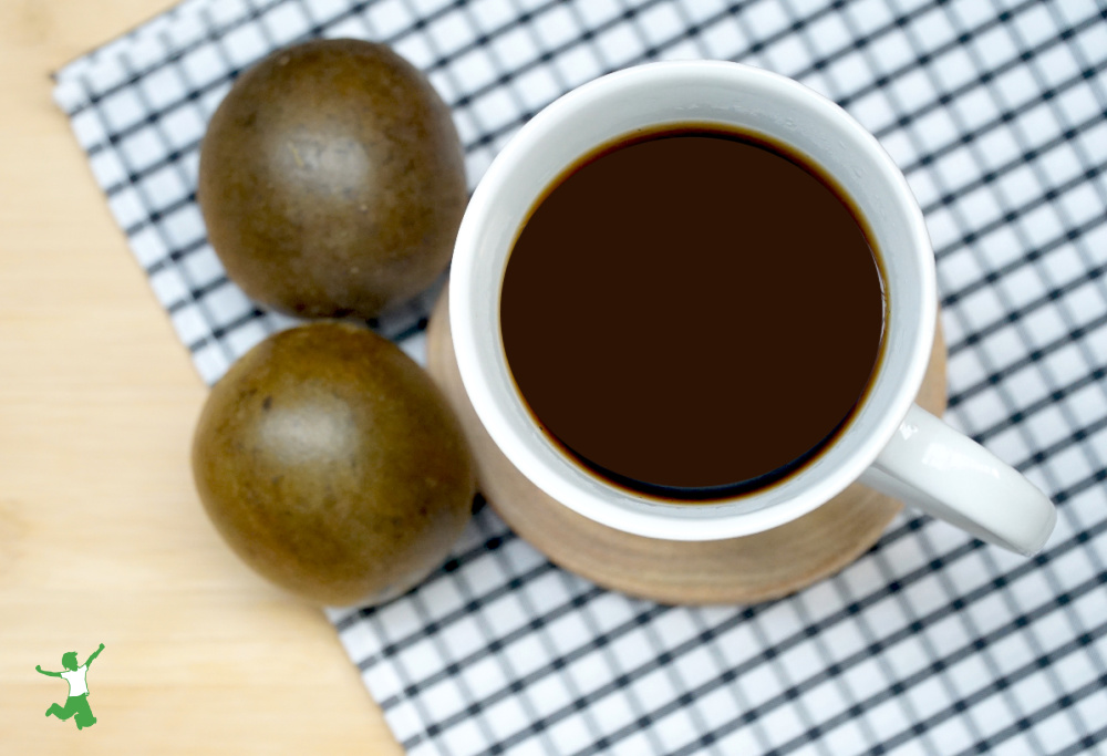 cup of coffee sweetened with monk fruit on tablecloth