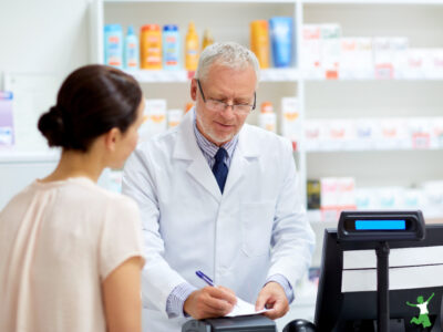 woman getting painkiller prescription from doctor