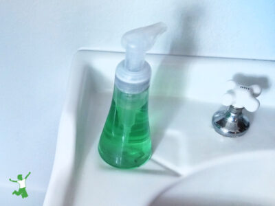 nontoxic liquid hand soap dispenser on white sink