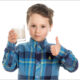 young boy drinking healthy milk substitute in a glass