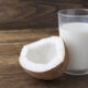 homemade and healthy coconut milk tonic beverage in a glass on wooden table