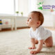 baby exposed to mRNA jabs crawling on white carpet floor