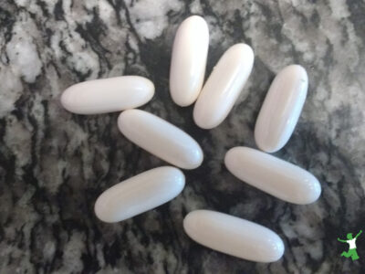 coconut oil capsules on granite table