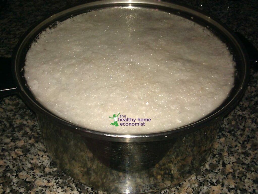 toxic aquafaba foam on pot of cooked beans