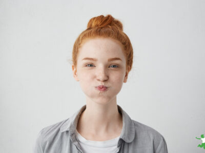 young woman oil pulling with coconut oil