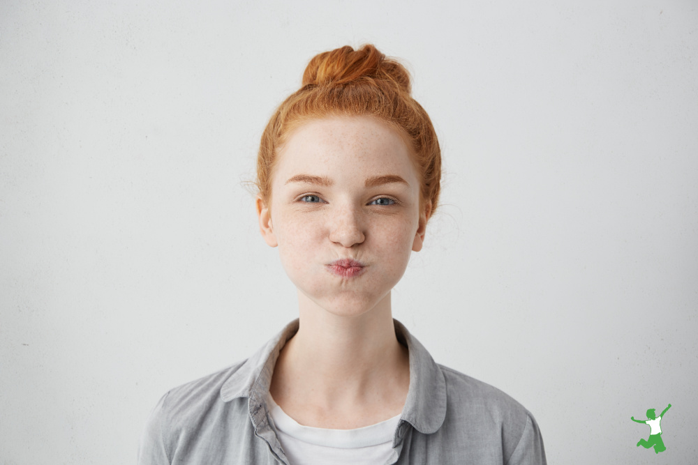 young woman oil pulling with coconut oil