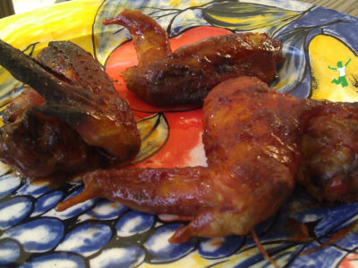 chicken wings baked in barbecue marinade on a platter