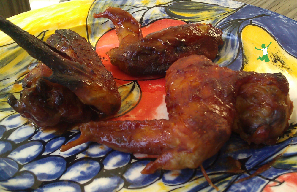 chicken wings baked in barbecue marinade on a platter