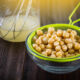 aquafaba strained into glass bowl using chickpea water sieve