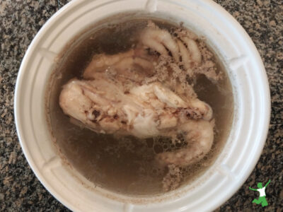 skimmed broth in white stockpot