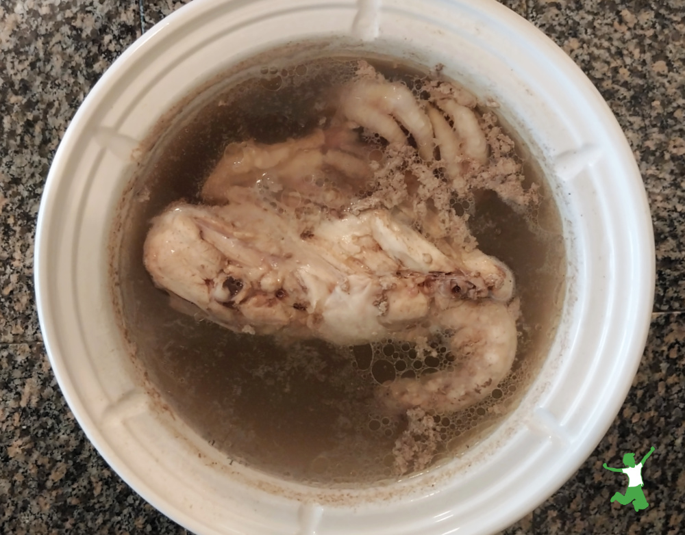 skimmed broth in white stockpot