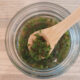 traditional mint sauce for lamb or mutton in glass jar with bamboo spoon