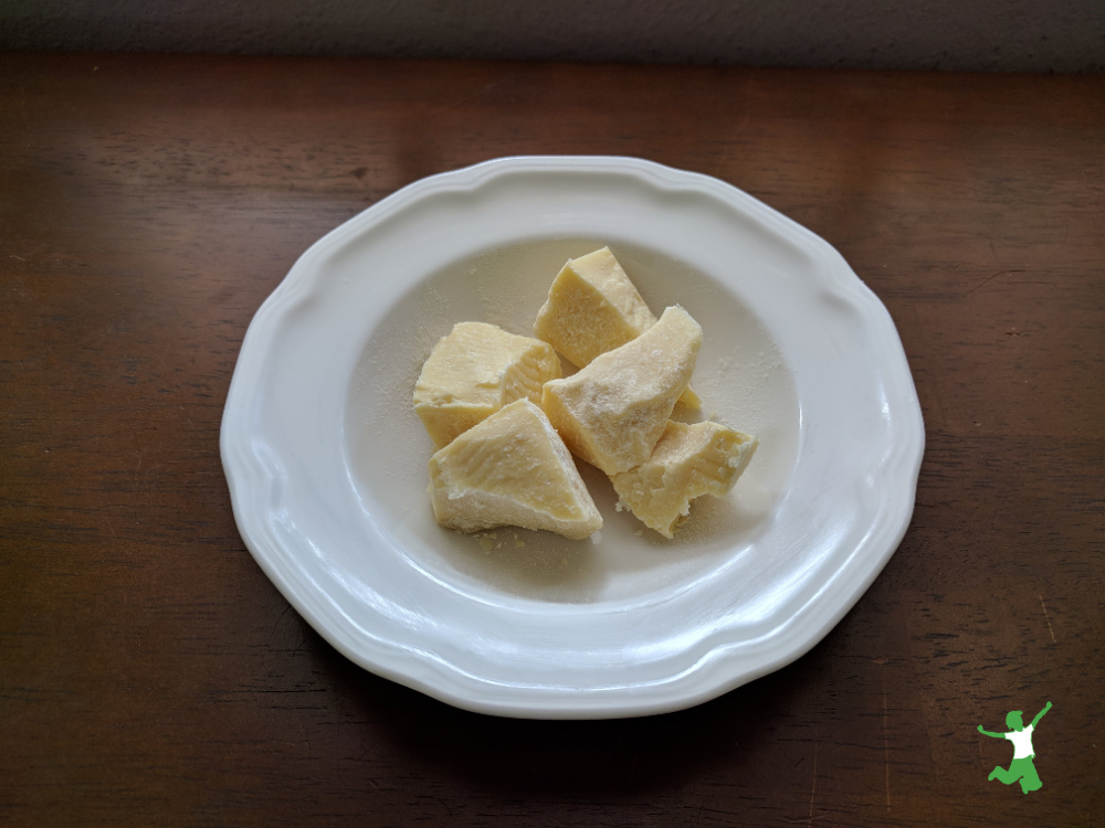 chunks of healthy cocoa butter in white bowl