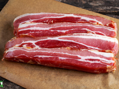 hickory smoked, sugar-free bacon on wood cutting board